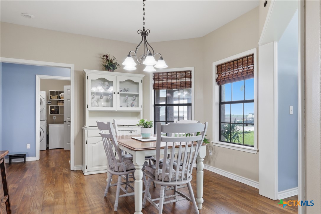 457-459 Buentello Road Victoria, TX 77905 - Photo 7 of 35 a view of a dining room with furniture wooden floor and chandelier