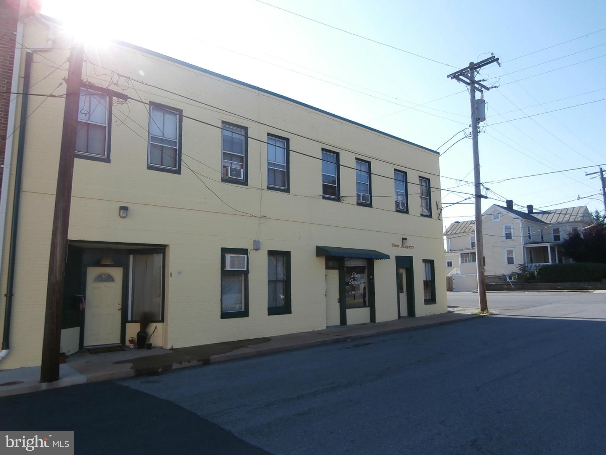 a front view of a building with a street