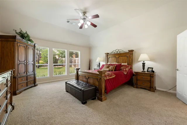 a kitchen with granite countertop a refrigerator a stove and a sink