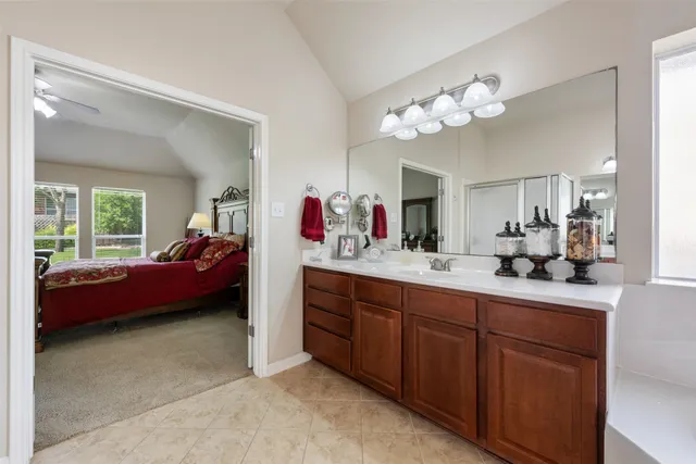 a bathroom with a shower and a sink