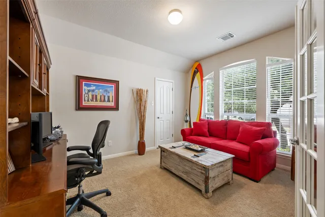 a living room with furniture and a window