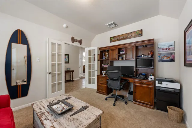 a workspace with furniture and a bathroom