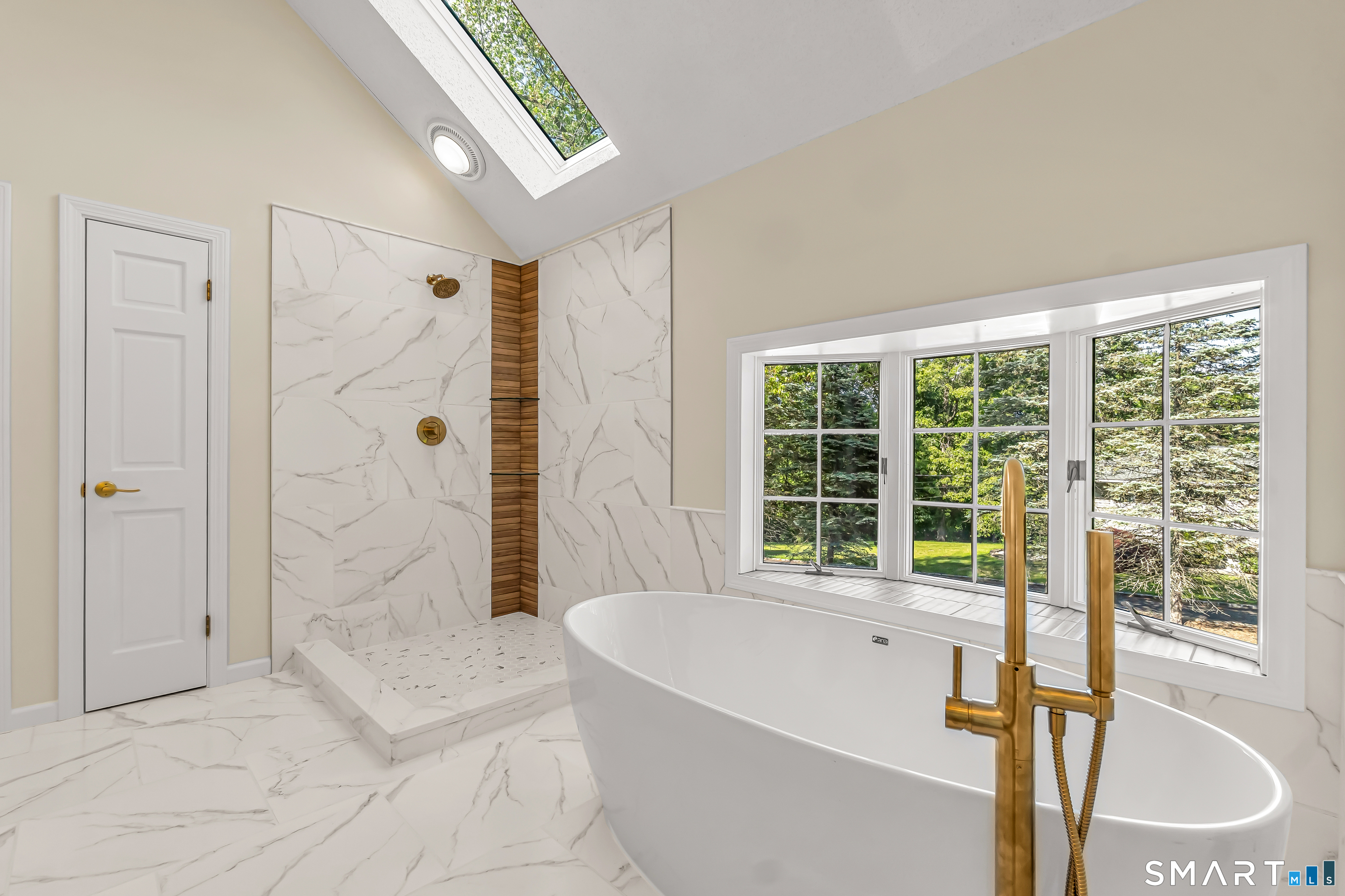 13 Pleasant Rise Circle Brookfield, CT 06804 - Photo 34 of 40 a bathroom with a tub a sink a window and a shower
