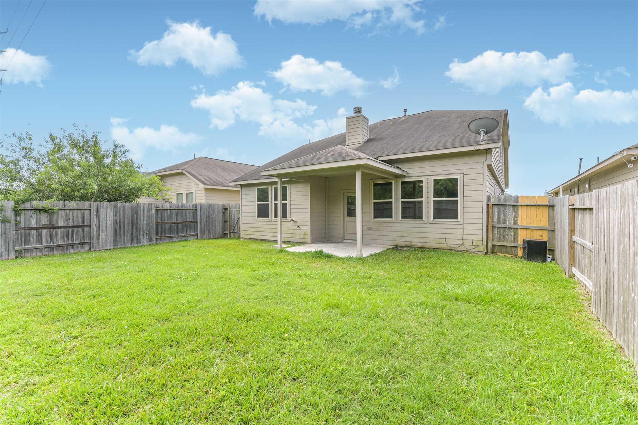 12638 Silver Winter Trail Houston, TX 77014 - Photo 24 of 35 Another Perspective Showing the Lush Lawn! Note the Large Window Ensuring Lots of Light to Make the Home Bright and Airy!