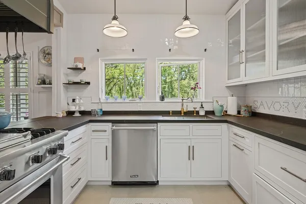 a bedroom with a bed a bookshelf and a window