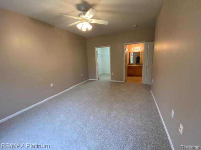 1105 Rial Lake Drive, Unit 45 Howell, MI 48843 - Photo 14 of 19 Primary bedroom looking toward walk-in closet and full glamour bath.