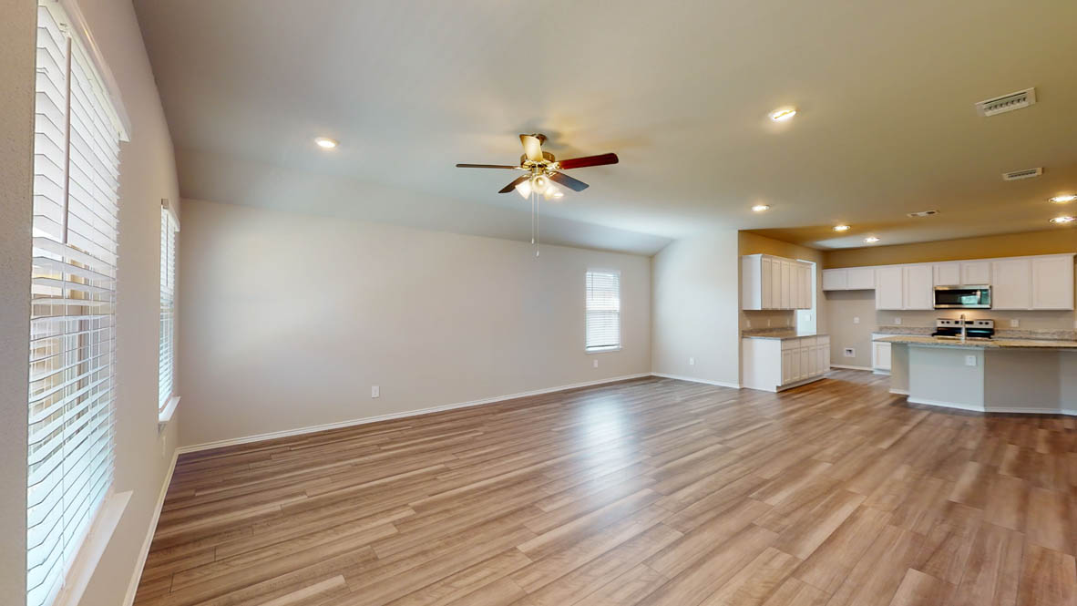 509 Hector Loop Georgetown, TX 78626 - Photo 31 of 31 An open floorplan seamlessly connects the living area with a well-appointed kitchen, ideal for modern entertaining.