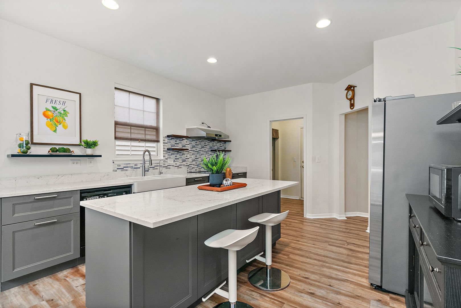 806 Viewpointe Drive St. Charles, IL 60174 - Photo 13 of 46 a kitchen with a sink cabinets and wooden floor