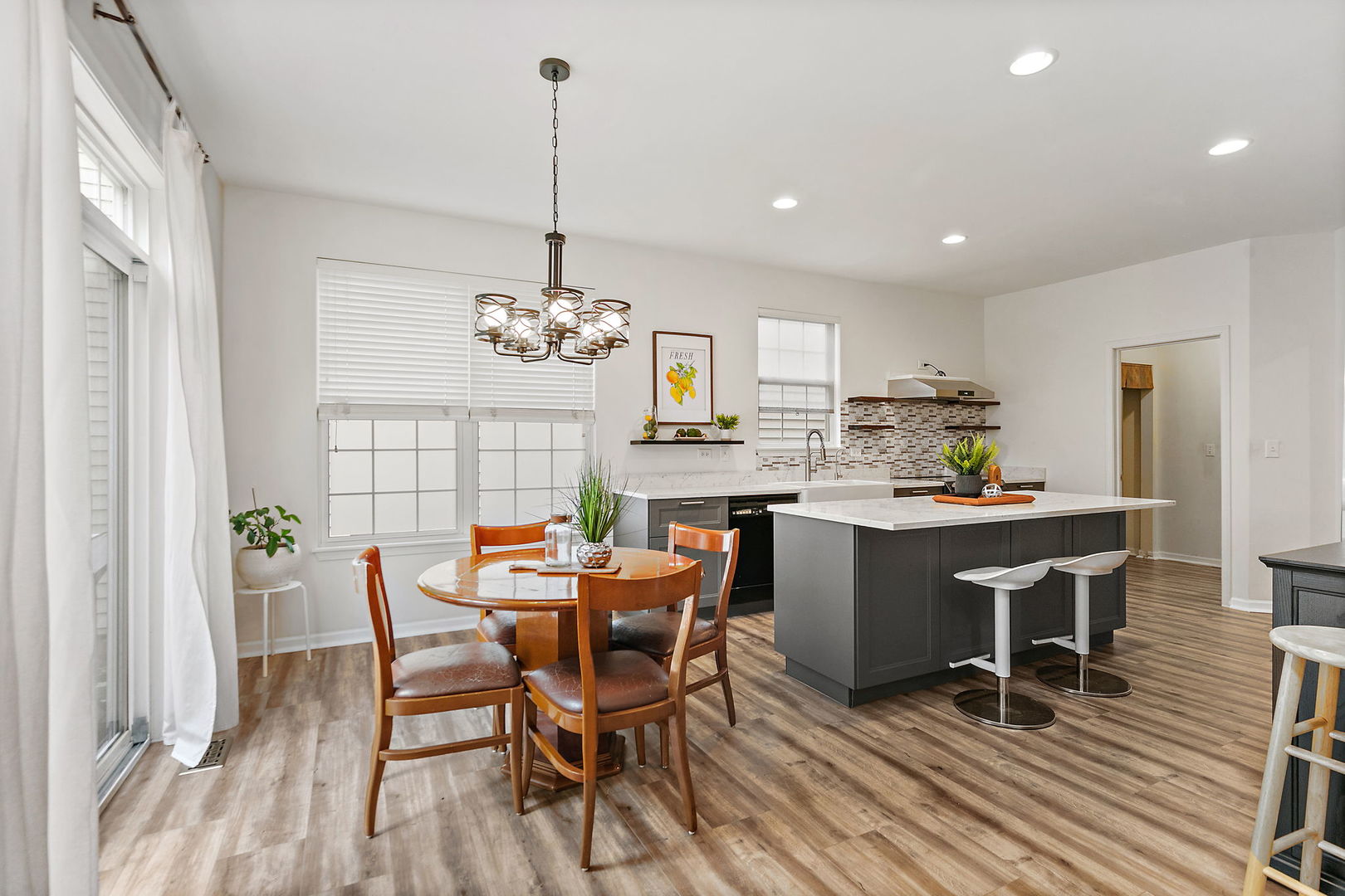 806 Viewpointe Drive St. Charles, IL 60174 - Photo 19 of 46 a dining room filled chandelier and wooden floor
