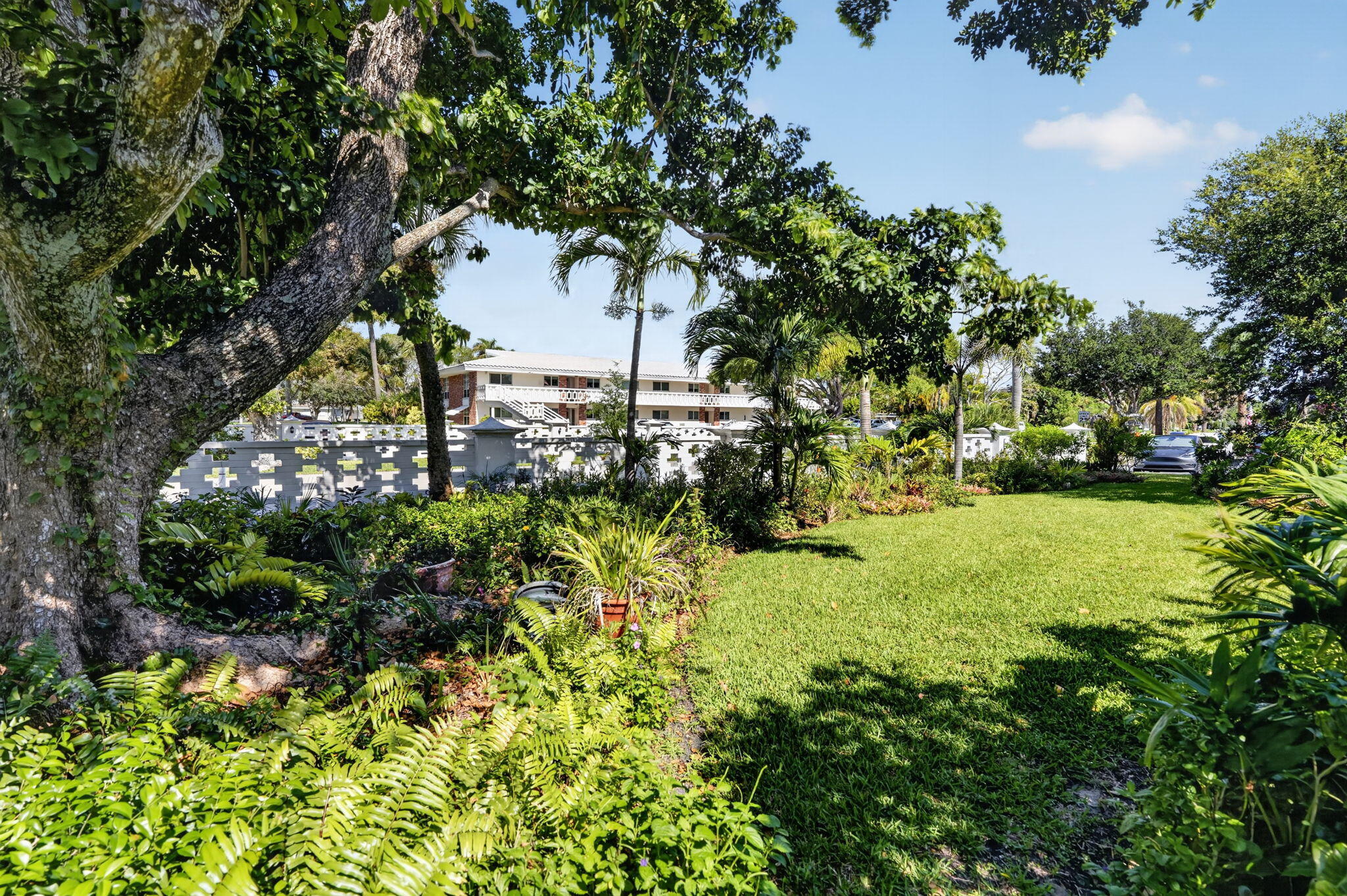 91 Willow Road, Unit 104 Tequesta, FL 33469 - Photo 20 of 25 Garden View from Screen Porch