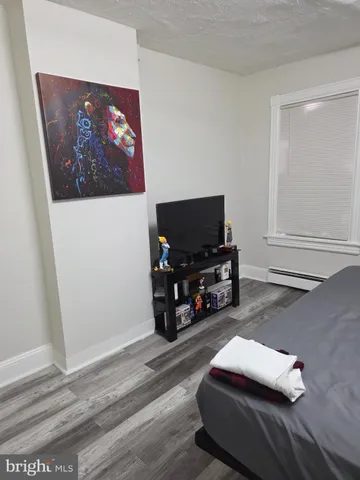 a room with furniture and a flat screen tv