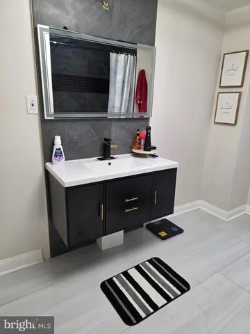 a room with a desk and cabinets