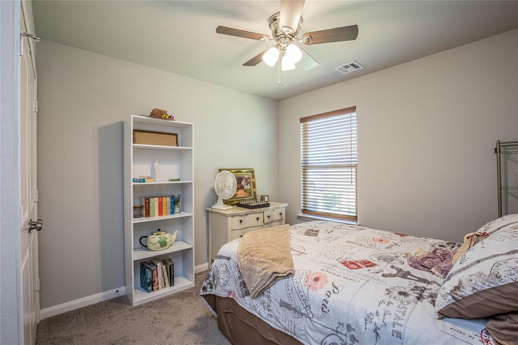 4028 Bravo Ranch Road Waco, TX 76705 - Photo 12 of 19 a bedroom with a bed dresser and a window