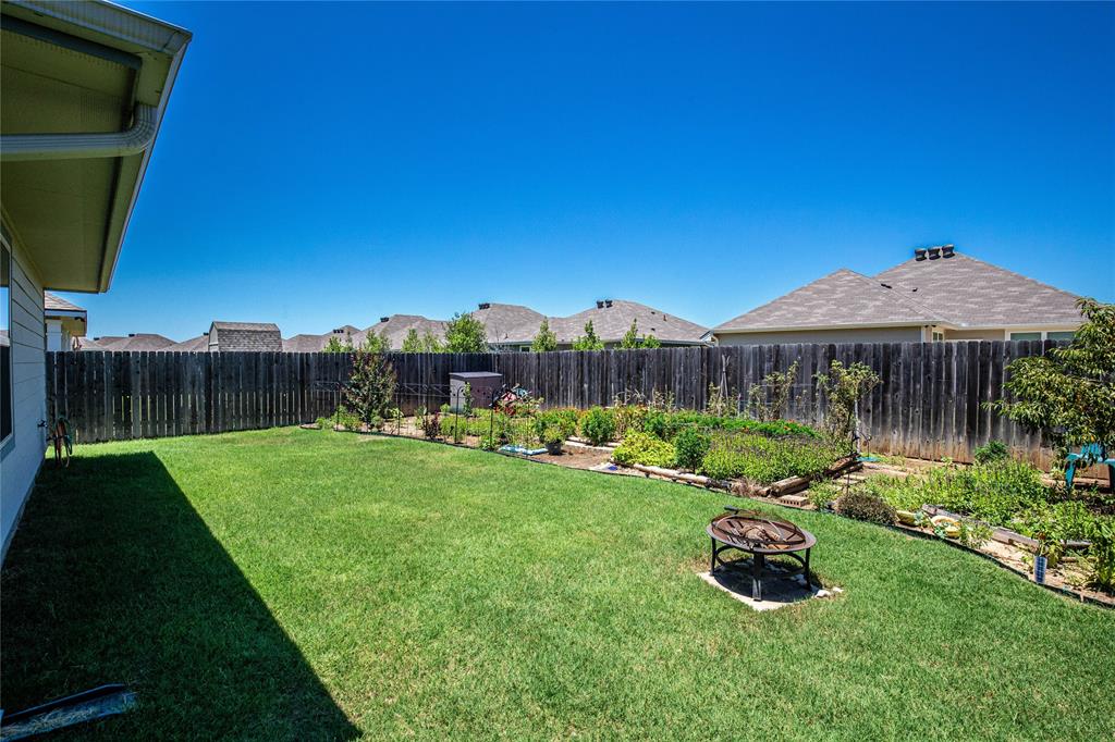 4028 Bravo Ranch Road Waco, TX 76705 - Photo 13 of 19 a view of a chair and table on the wooden deck