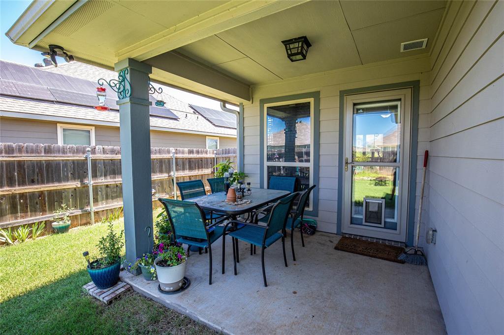 4028 Bravo Ranch Road Waco, TX 76705 - Photo 18 of 19 a view of a patio with a table and chairs