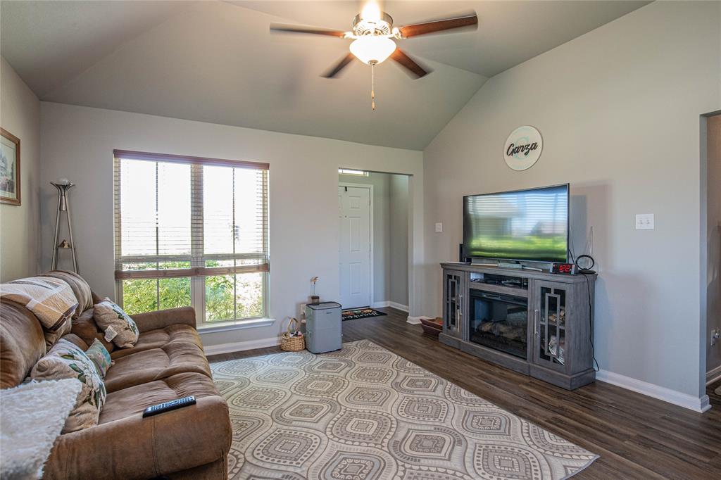 4028 Bravo Ranch Road Waco, TX 76705 - Photo 2 of 19 a living room with furniture and a flat screen tv
