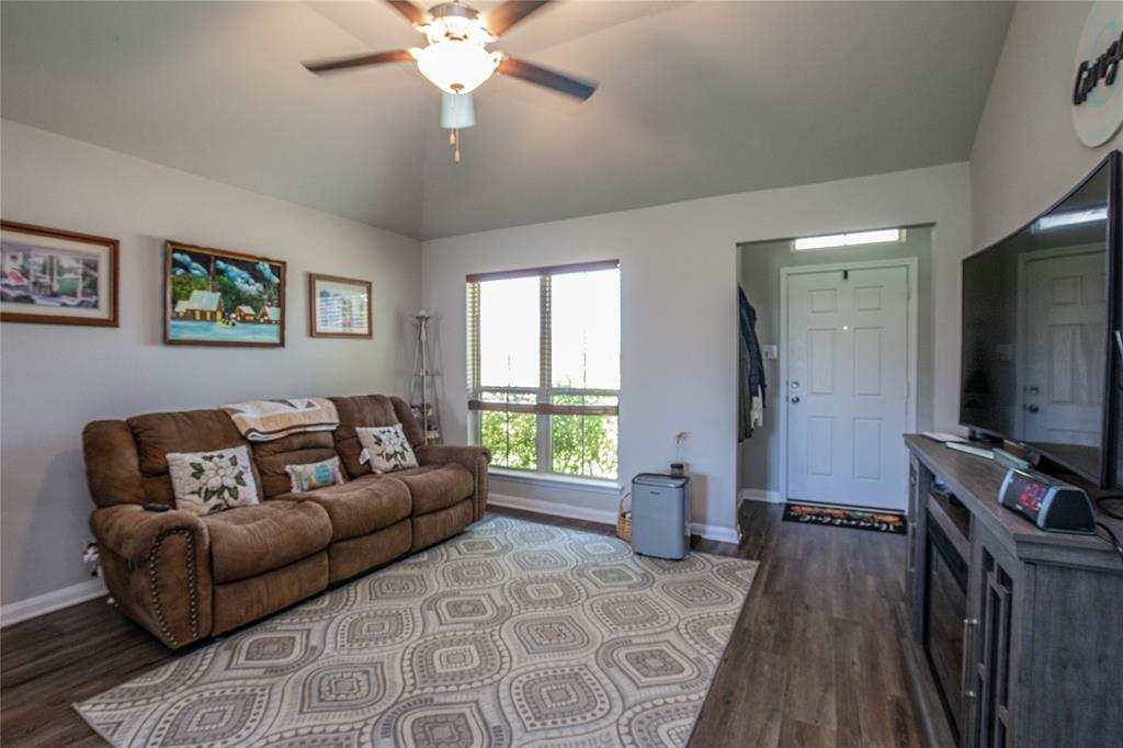 4028 Bravo Ranch Road Waco, TX 76705 - Photo 3 of 19 a living room with furniture and a flat screen tv