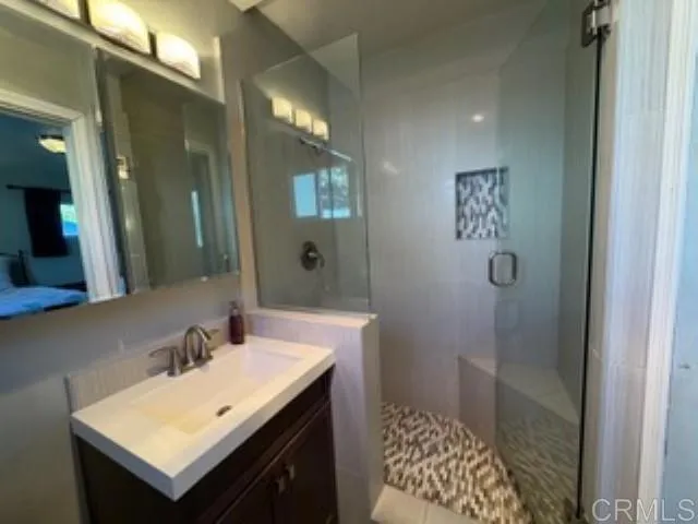 a bathroom with a sink and a mirror