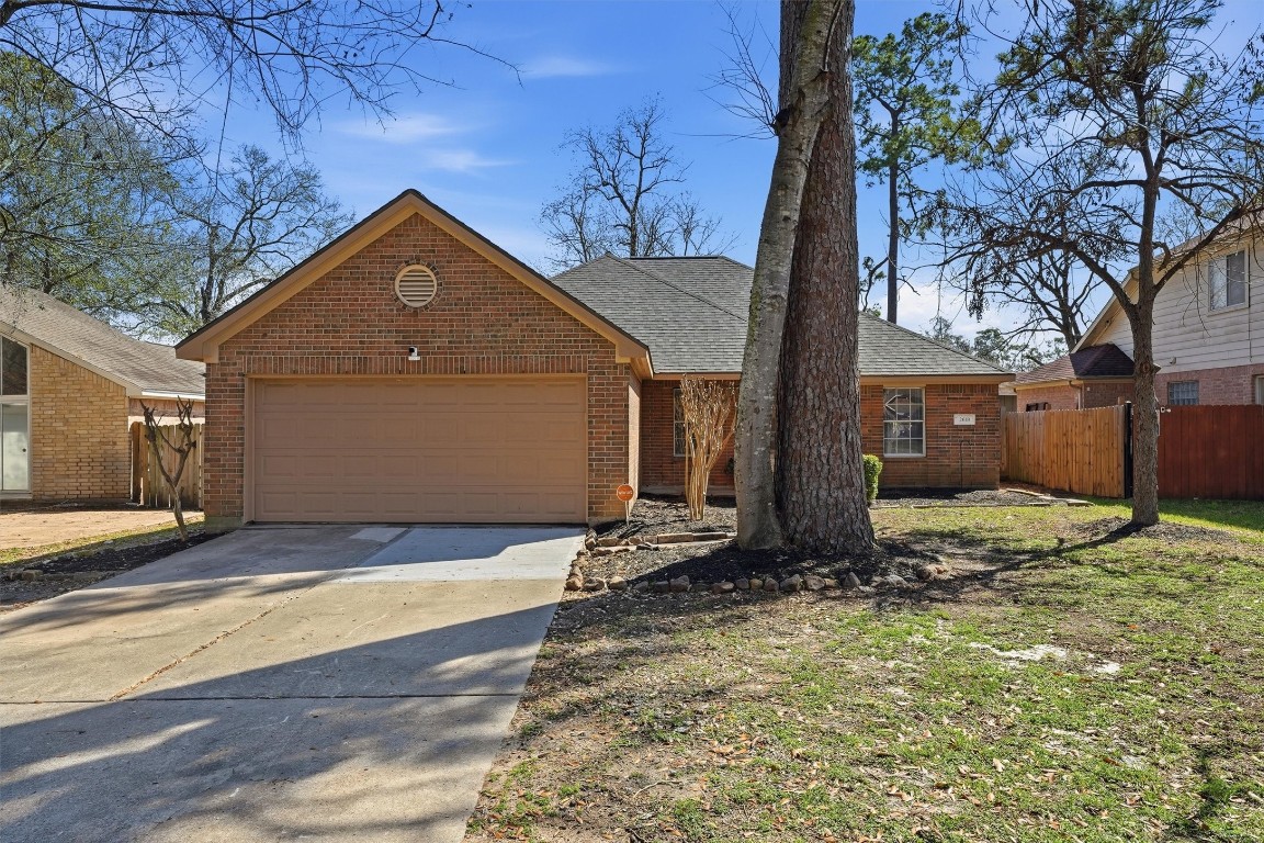 2618 Heather Knoll Drive Spring, TX 77373 - Photo 2 of 32 a front view of a house with garden