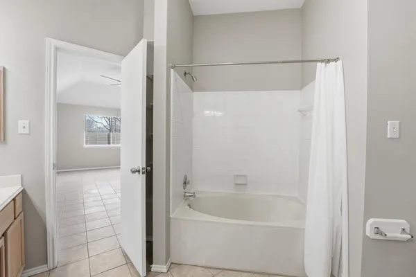 a spacious bathroom with a double vanity sink mirror and
