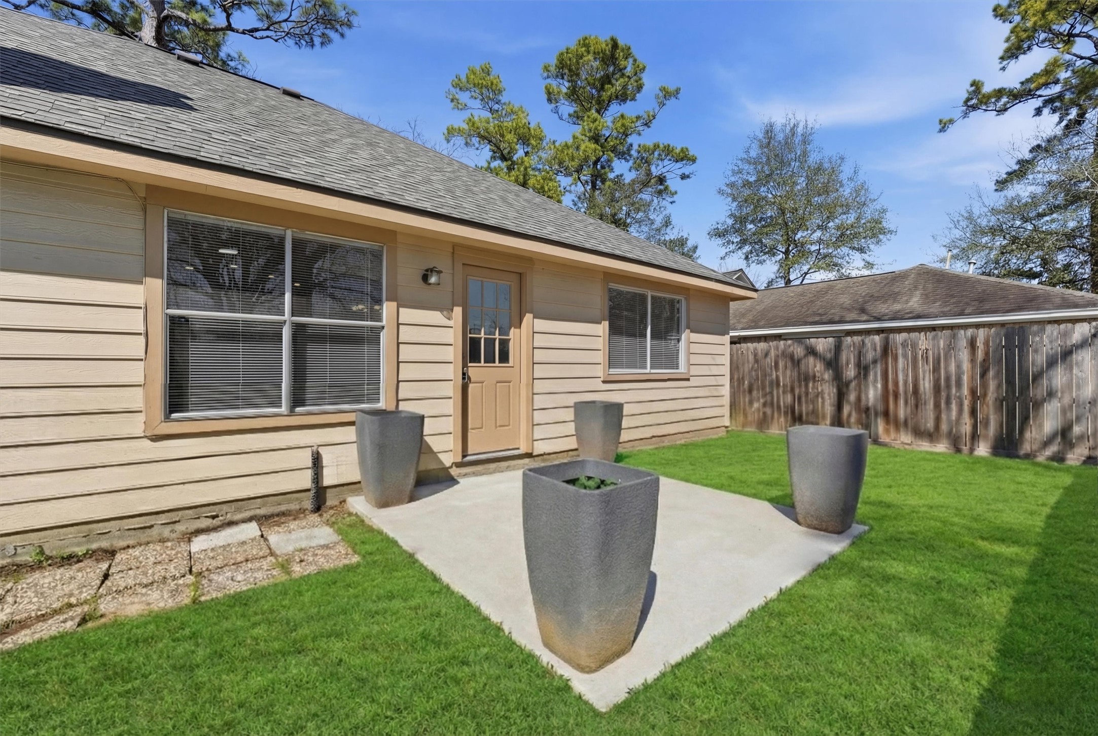 2618 Heather Knoll Drive Spring, TX 77373 - Photo 27 of 32 a view of a house with backyard sitting area and garden
