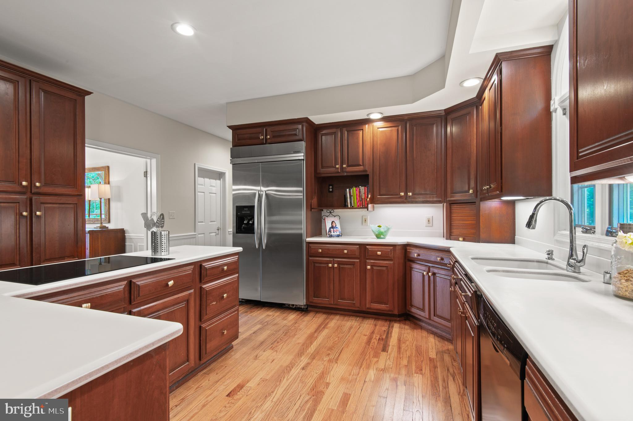 8 Henderson Hill Court Monkton, MD 21111 - Photo 12 of 55 a kitchen with stainless steel appliances kitchen island granite countertop a sink stove and refrigerator