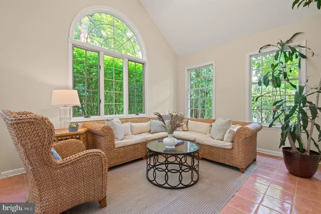 a view of a dining room with furniture a chandelier and wooden floor