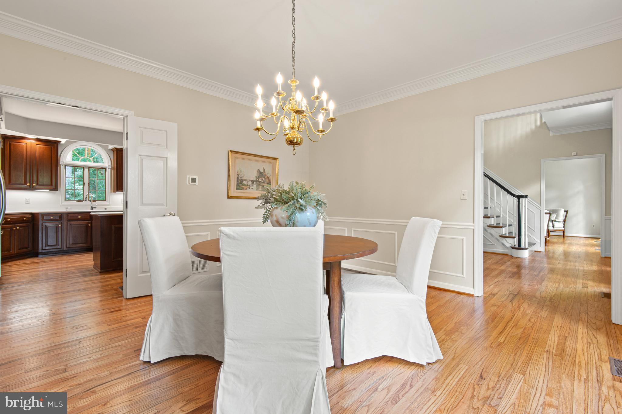 8 Henderson Hill Court Monkton, MD 21111 - Photo 17 of 55 a view of a dining room with furniture a chandelier and wooden floor