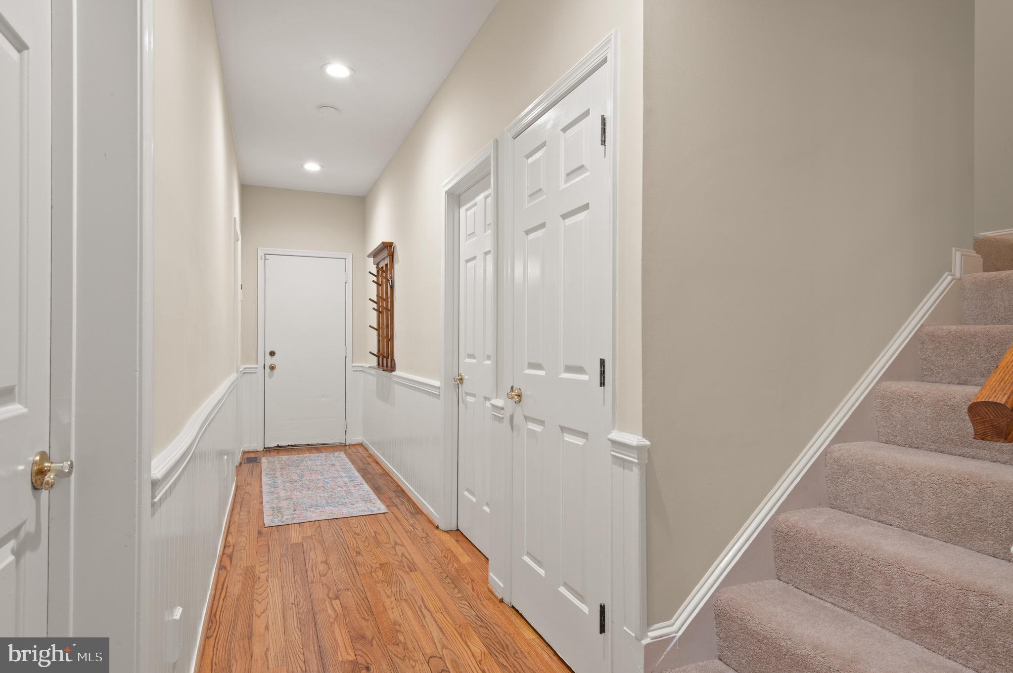 8 Henderson Hill Court Monkton, MD 21111 - Photo 20 of 55 a view of a hallway with wooden floor and staircase