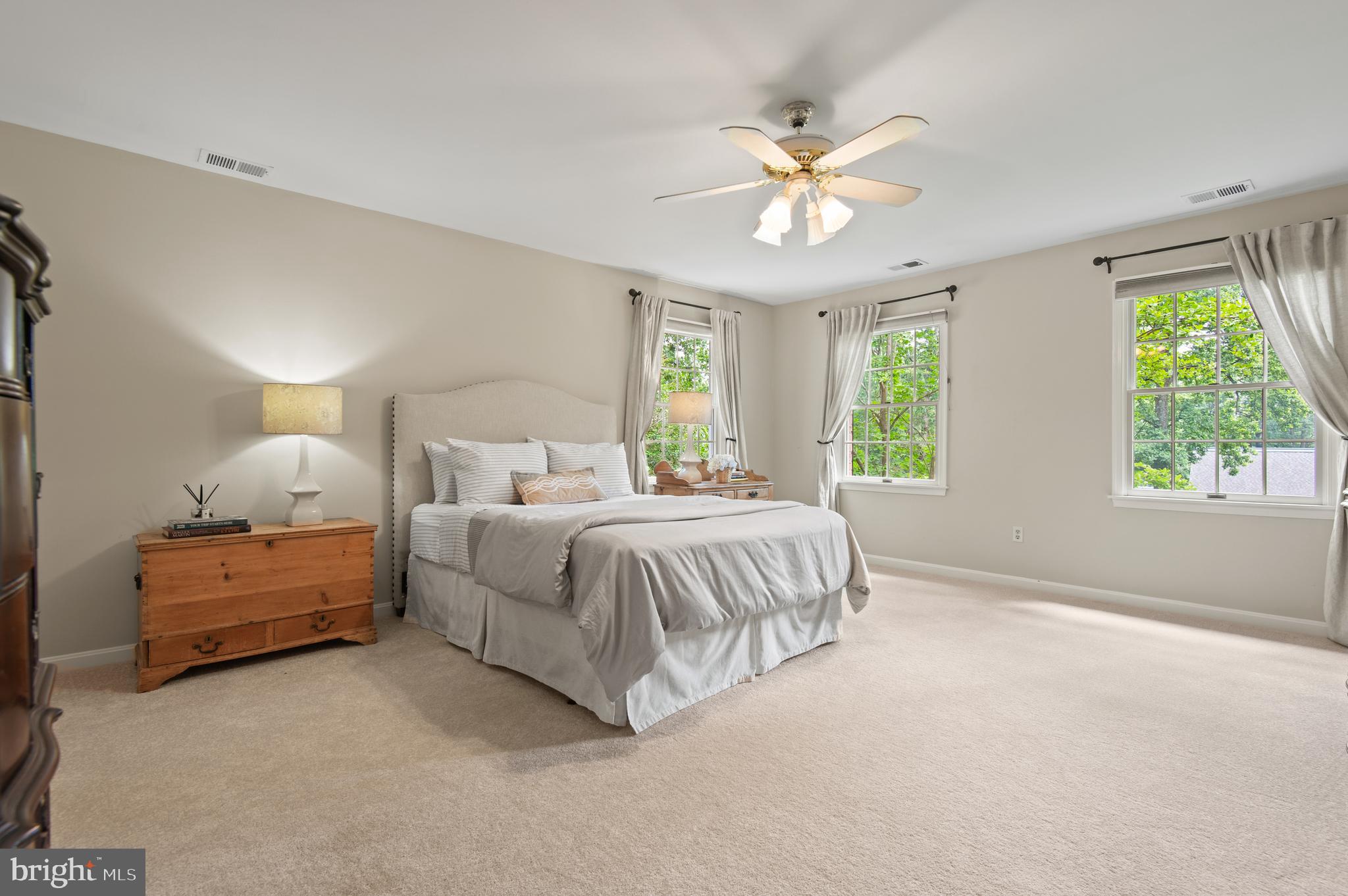 8 Henderson Hill Court Monkton, MD 21111 - Photo 24 of 55 a spacious bedroom with a bed and a chandelier