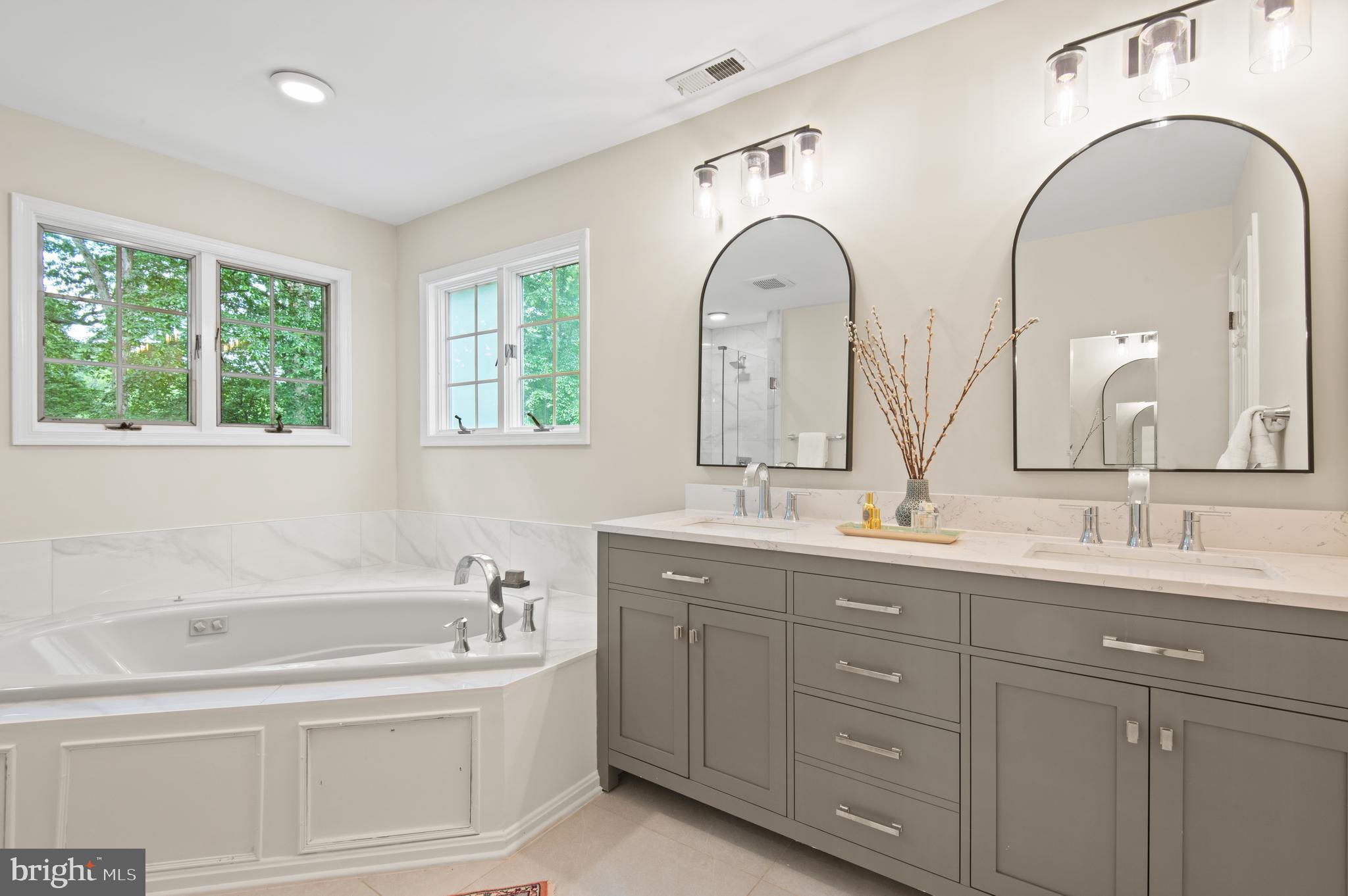8 Henderson Hill Court Monkton, MD 21111 - Photo 26 of 55 a spacious bathroom with a granite countertop sink a mirror and a bathtub