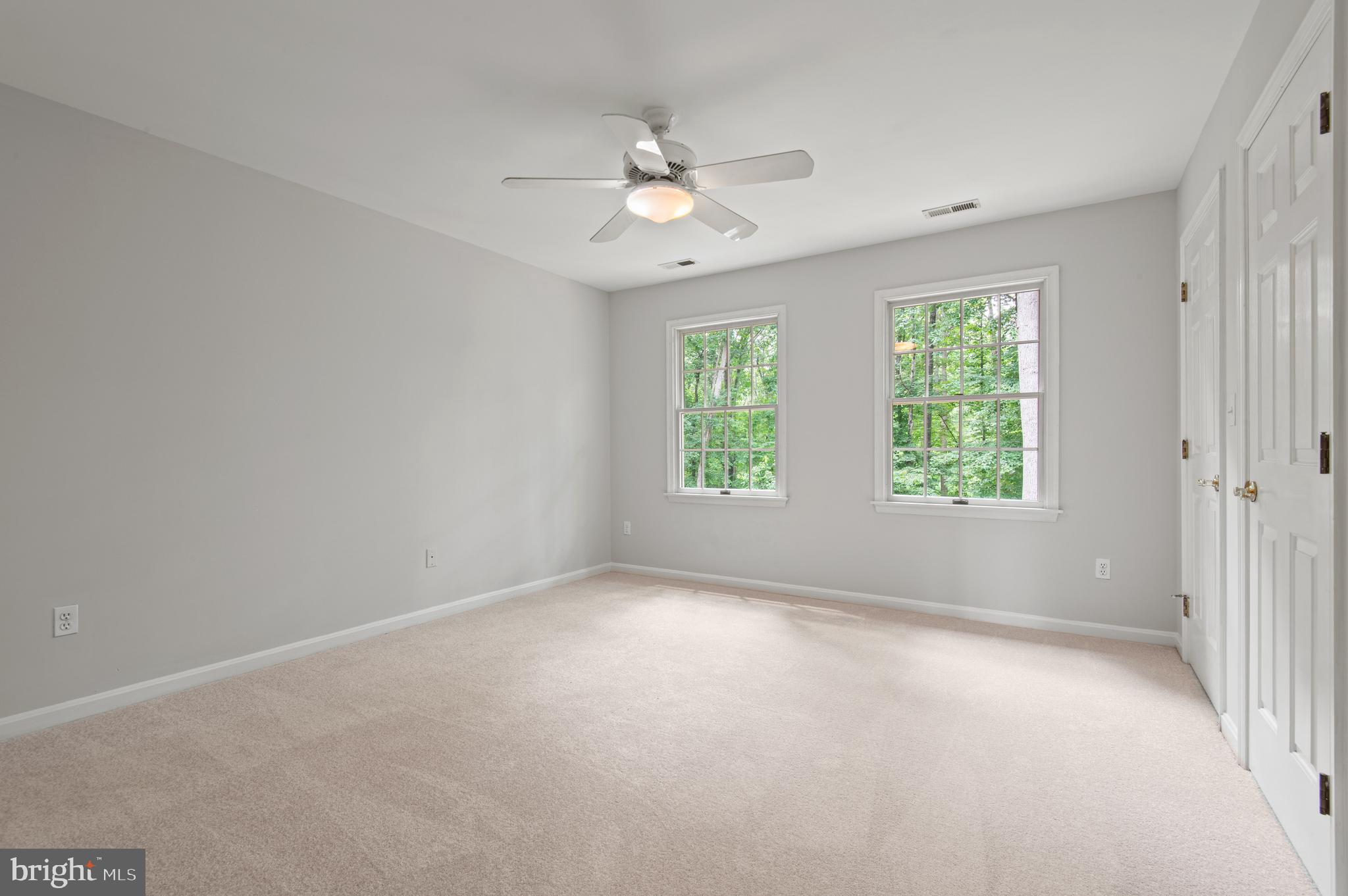 8 Henderson Hill Court Monkton, MD 21111 - Photo 29 of 55 an empty room with windows and ceiling fan