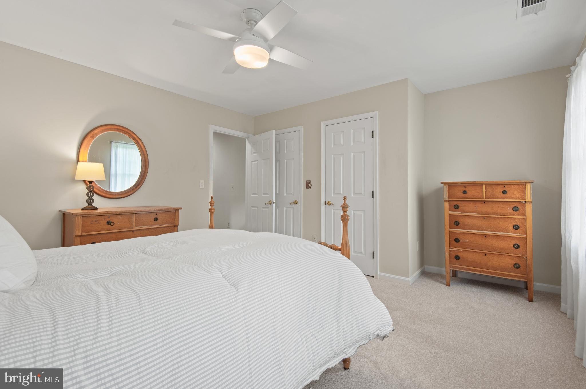 8 Henderson Hill Court Monkton, MD 21111 - Photo 30 of 55 a bedroom with a bed and a chandelier