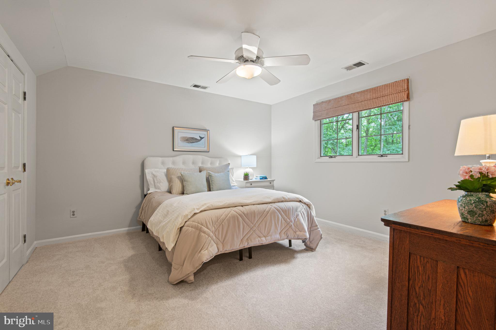 8 Henderson Hill Court Monkton, MD 21111 - Photo 33 of 55 a spacious bedroom with a bed and a potted plant