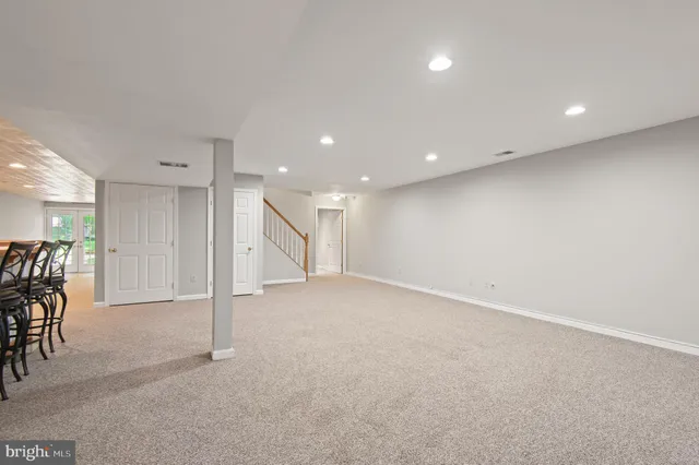 an empty room with furniture and a table