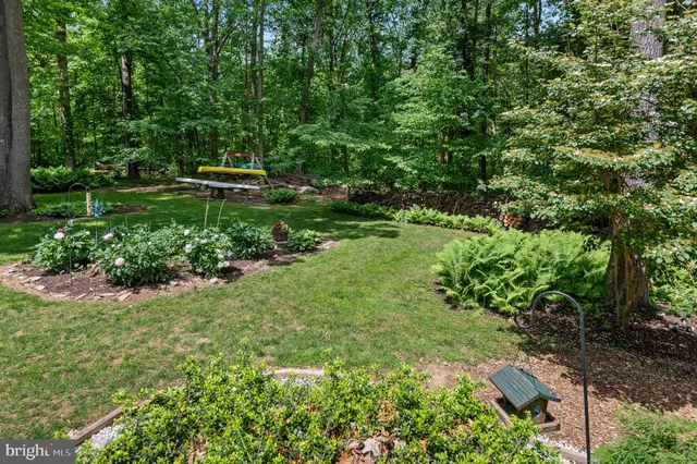 a view of a wooden chairs and table in the patio