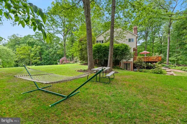 a view of deck with chairs and wooden floor