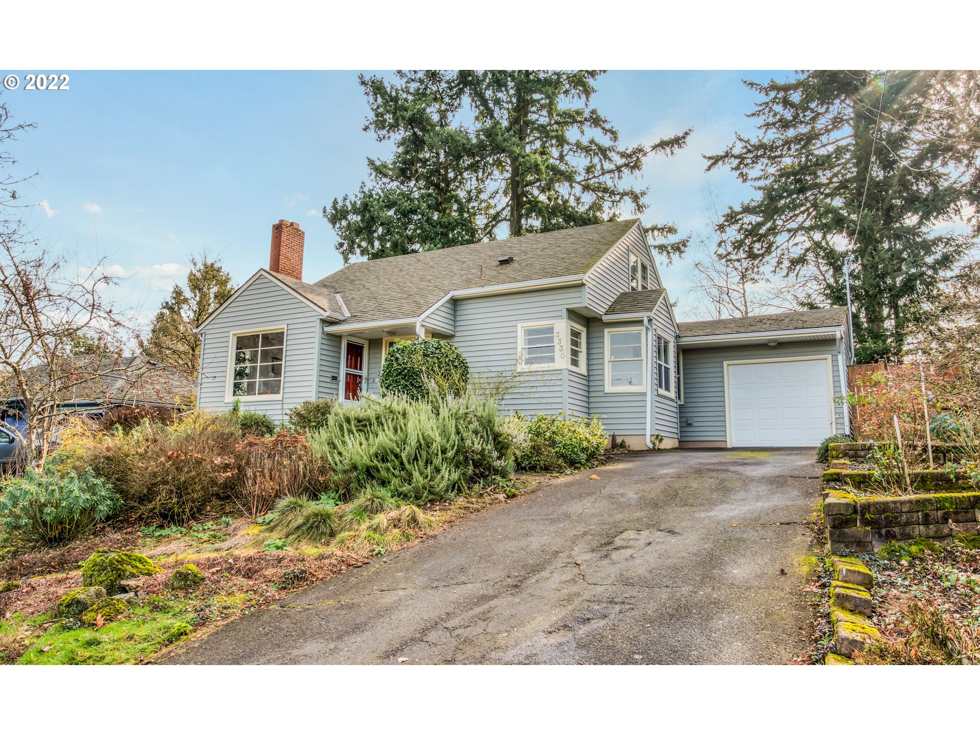3330 Southwest Primrose Street Portland, OR 97219 - Photo 1 of 26 a front view of a house with garden