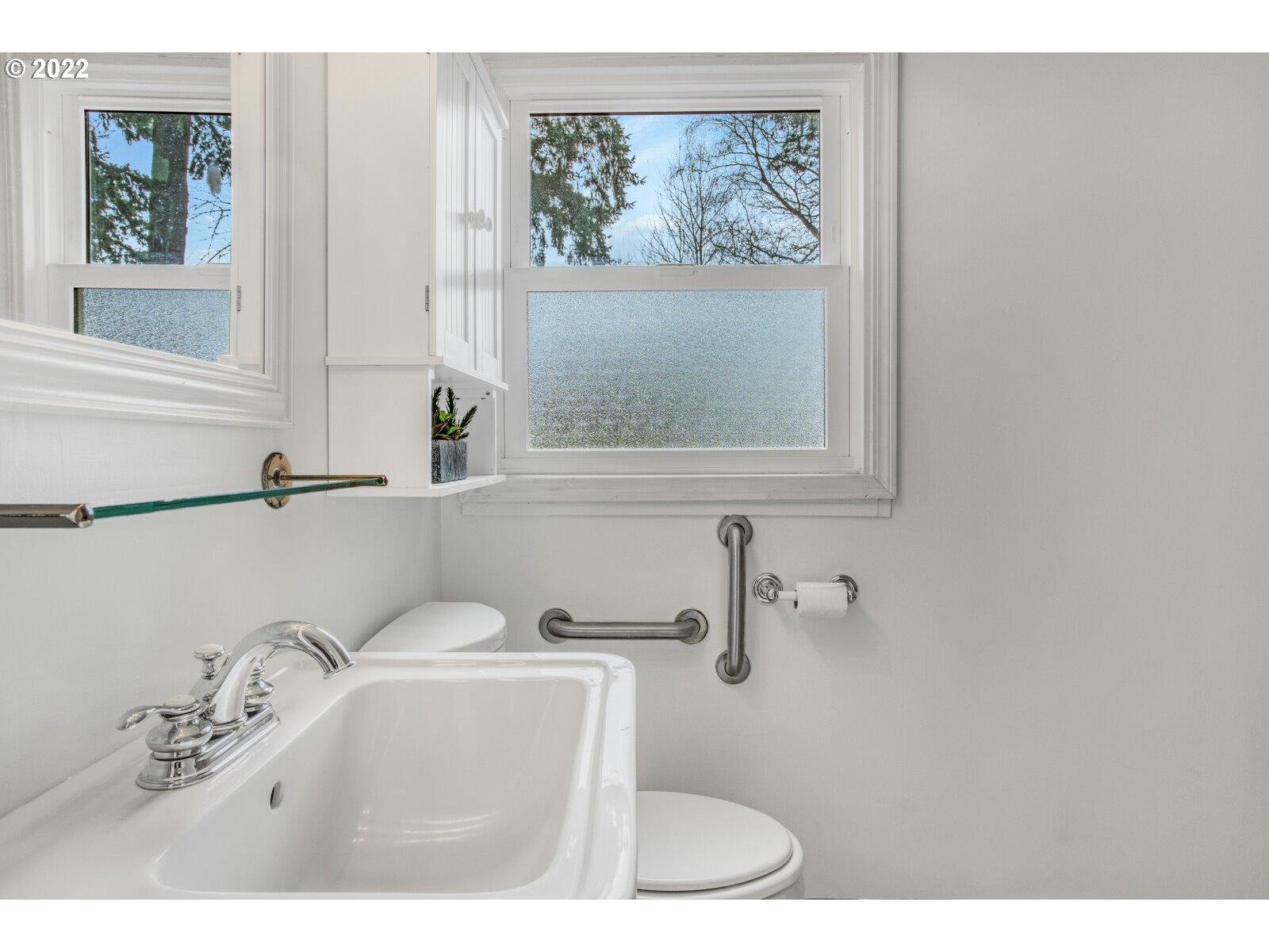 3330 Southwest Primrose Street Portland, OR 97219 - Photo 14 of 26 a bathroom with a sink and a mirror