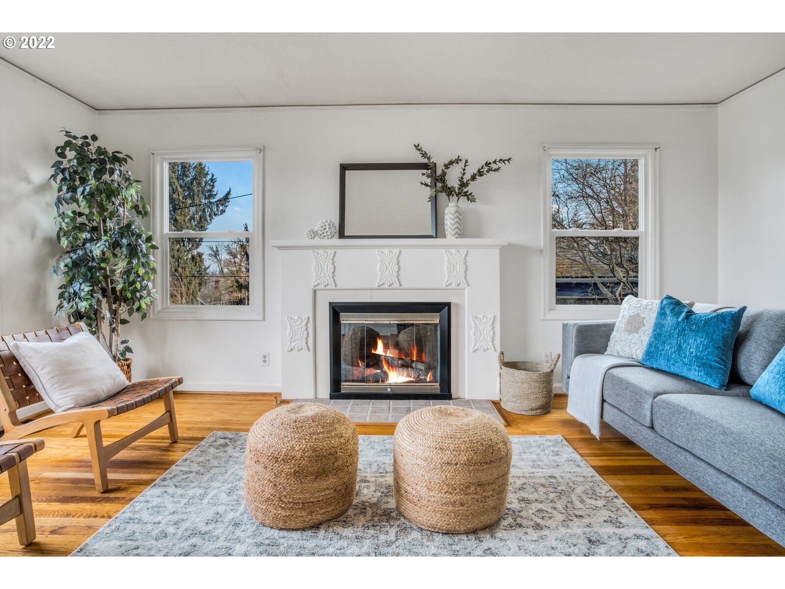 3330 Southwest Primrose Street Portland, OR 97219 - Photo 3 of 26 a living room with furniture and a fireplace