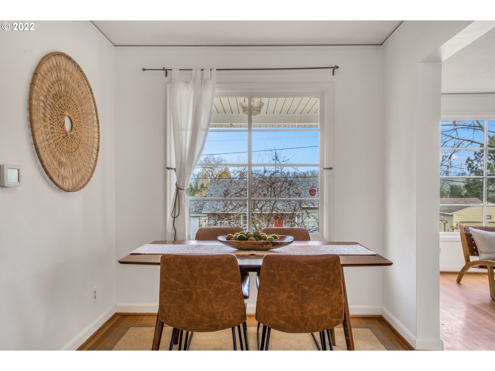 3330 Southwest Primrose Street Portland, OR 97219 - Photo 6 of 26 a view of a dining room with furniture and a window
