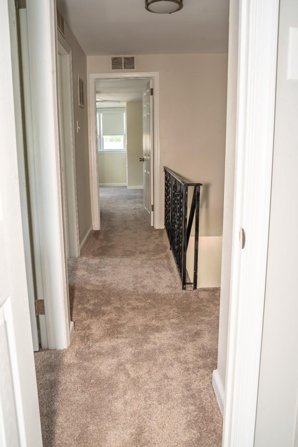 753 East 25th Street Chester, PA 19013 - Photo 16 of 47 Light illuminated hall with neutral carpet.