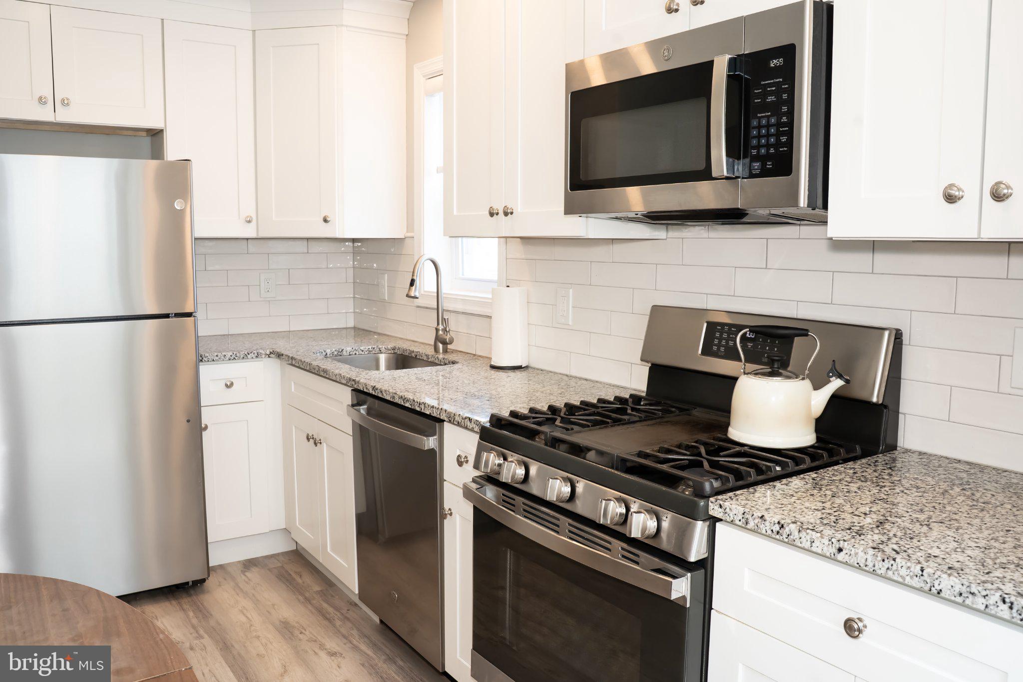 753 East 25th Street Chester, PA 19013 - Photo 4 of 47 Modern kitchen with sleek finishes.