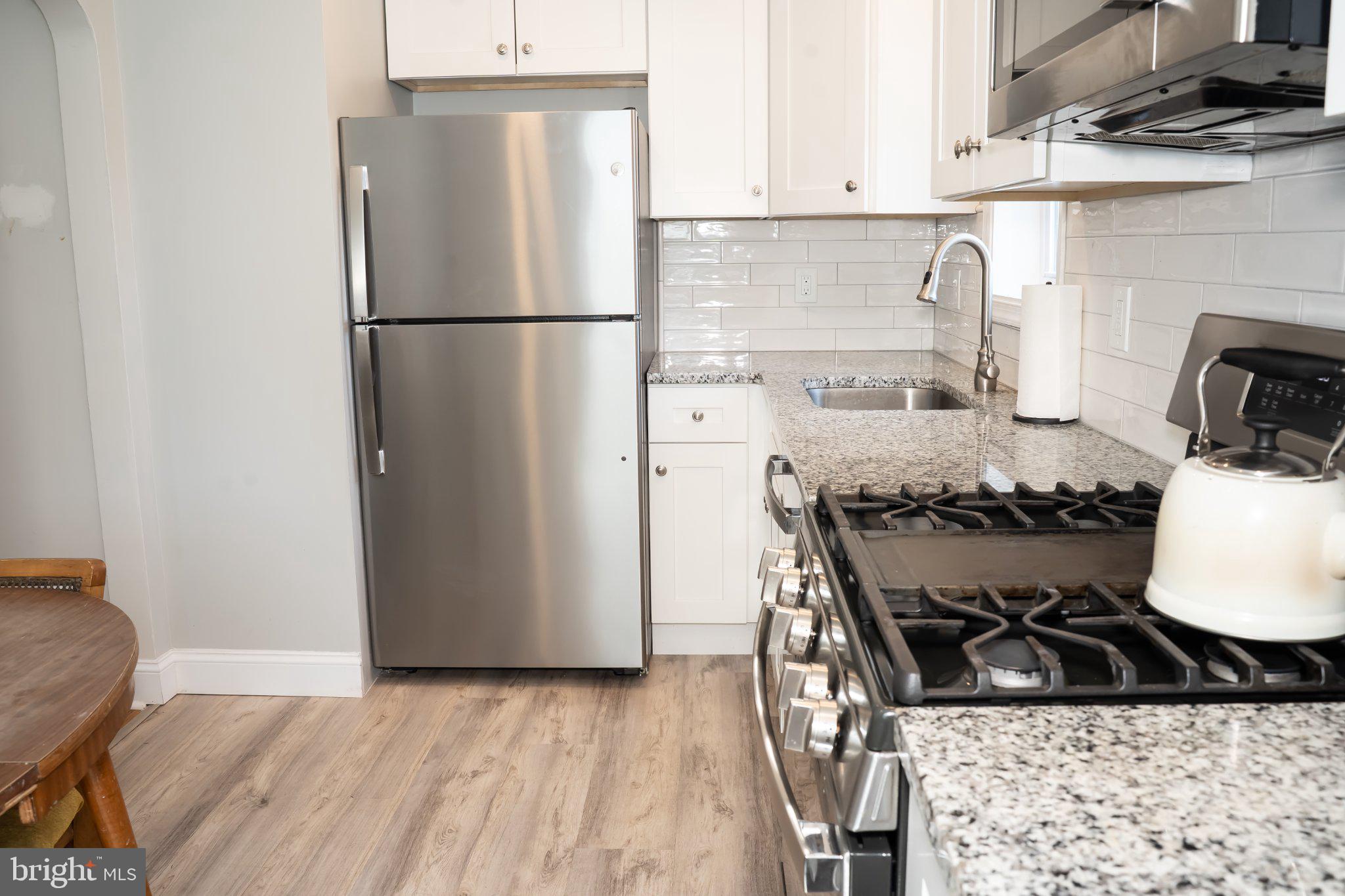 753 East 25th Street Chester, PA 19013 - Photo 6 of 47 Modern kitchen with sleek finishes.