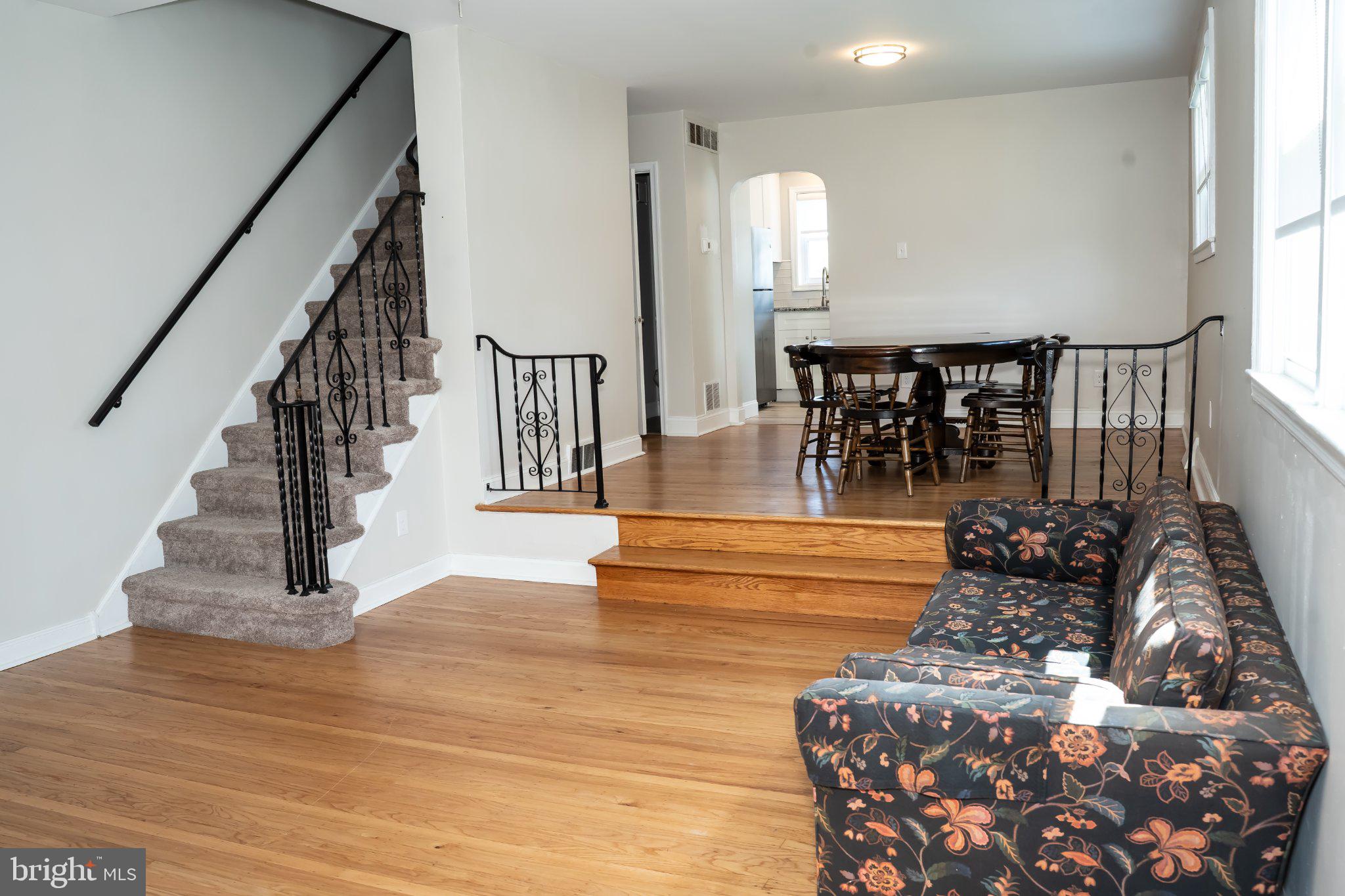 753 East 25th Street Chester, PA 19013 - Photo 9 of 47 Spacious living area with elegant stairs.