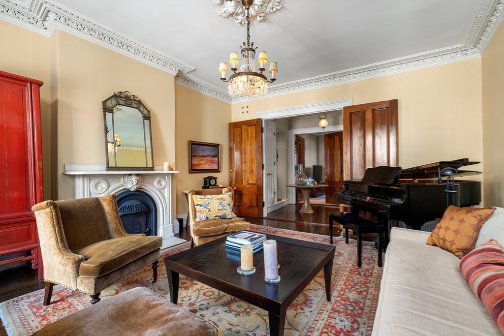 54 Union Park Boston, MA 02116 - Photo 12 of 35 a living room with furniture and a chandelier