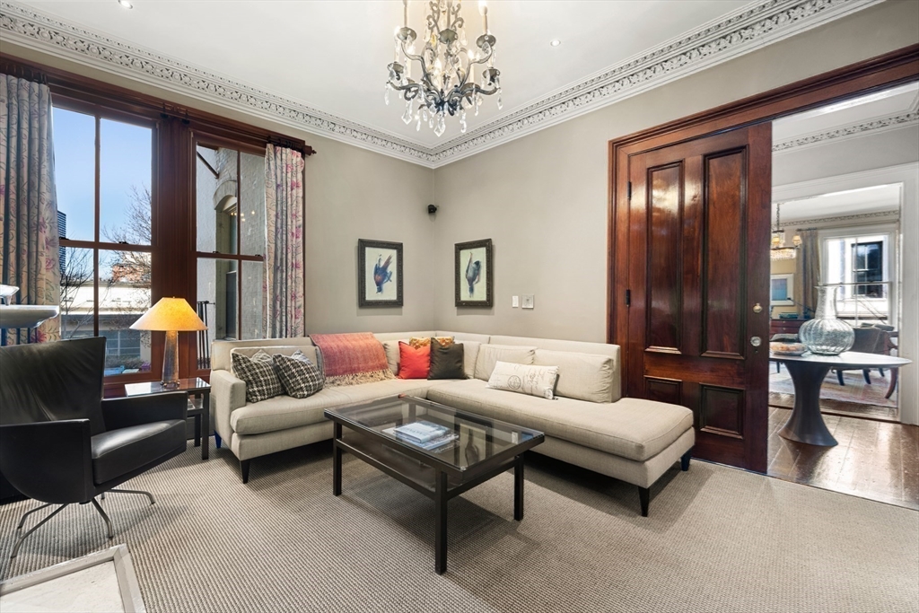 54 Union Park Boston, MA 02116 - Photo 13 of 35 a living room with furniture and a large window