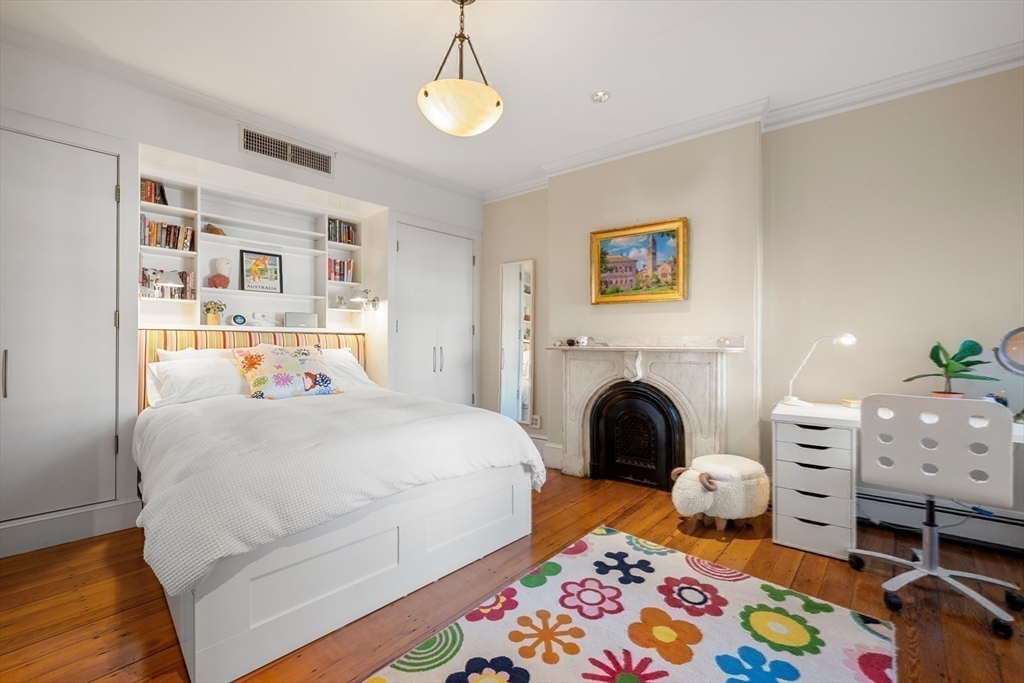 54 Union Park Boston, MA 02116 - Photo 15 of 35 a bedroom with a bed and a fireplace