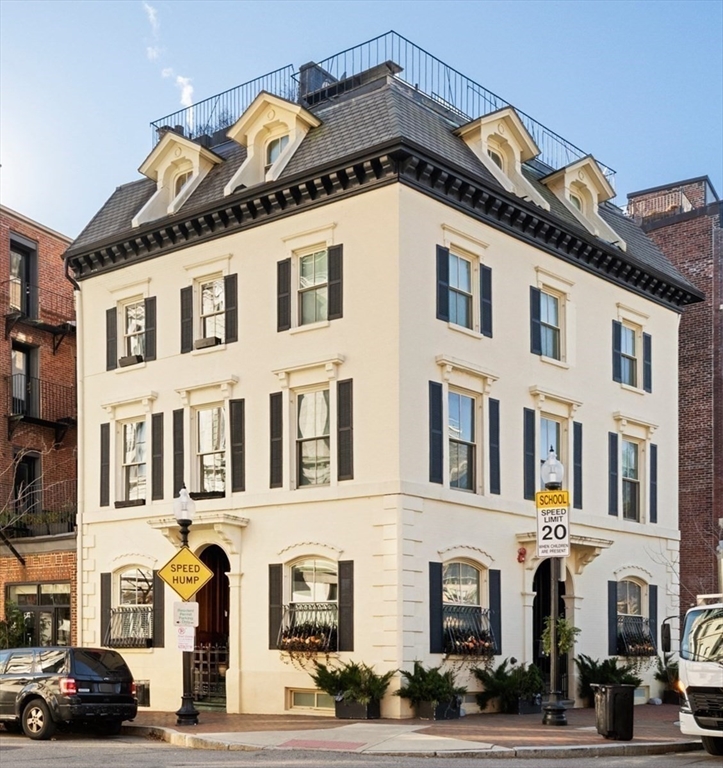 54 Union Park Boston, MA 02116 - Photo 2 of 35 a front view of a building with lot of cars and trees