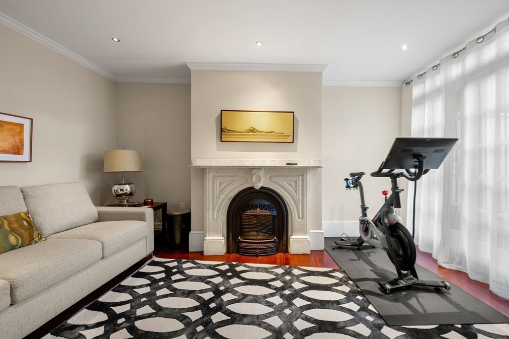 54 Union Park Boston, MA 02116 - Photo 29 of 35 a living room with furniture and a fireplace
